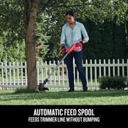 Craftsman CMCST915C1 string trimmer used outdoors near tree, showing automatic feed spool feature.
