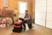 Photo of Craftsman CMST60403 rolling toolbox stack in a garage, person placing a case on the stack, product in use.